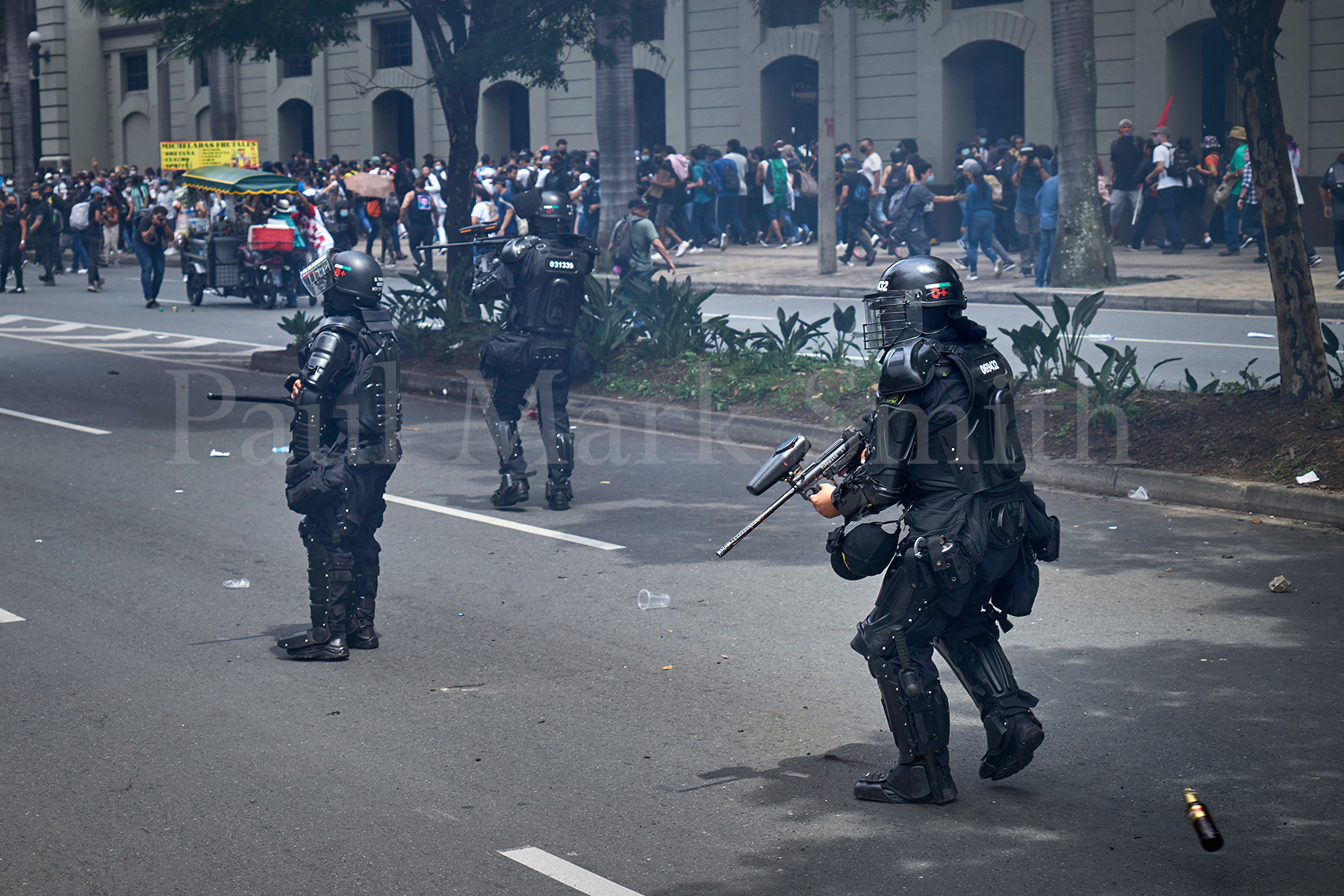 Police confront stone throwing protesters on the first day of the Colombian National Stoppage of 2021