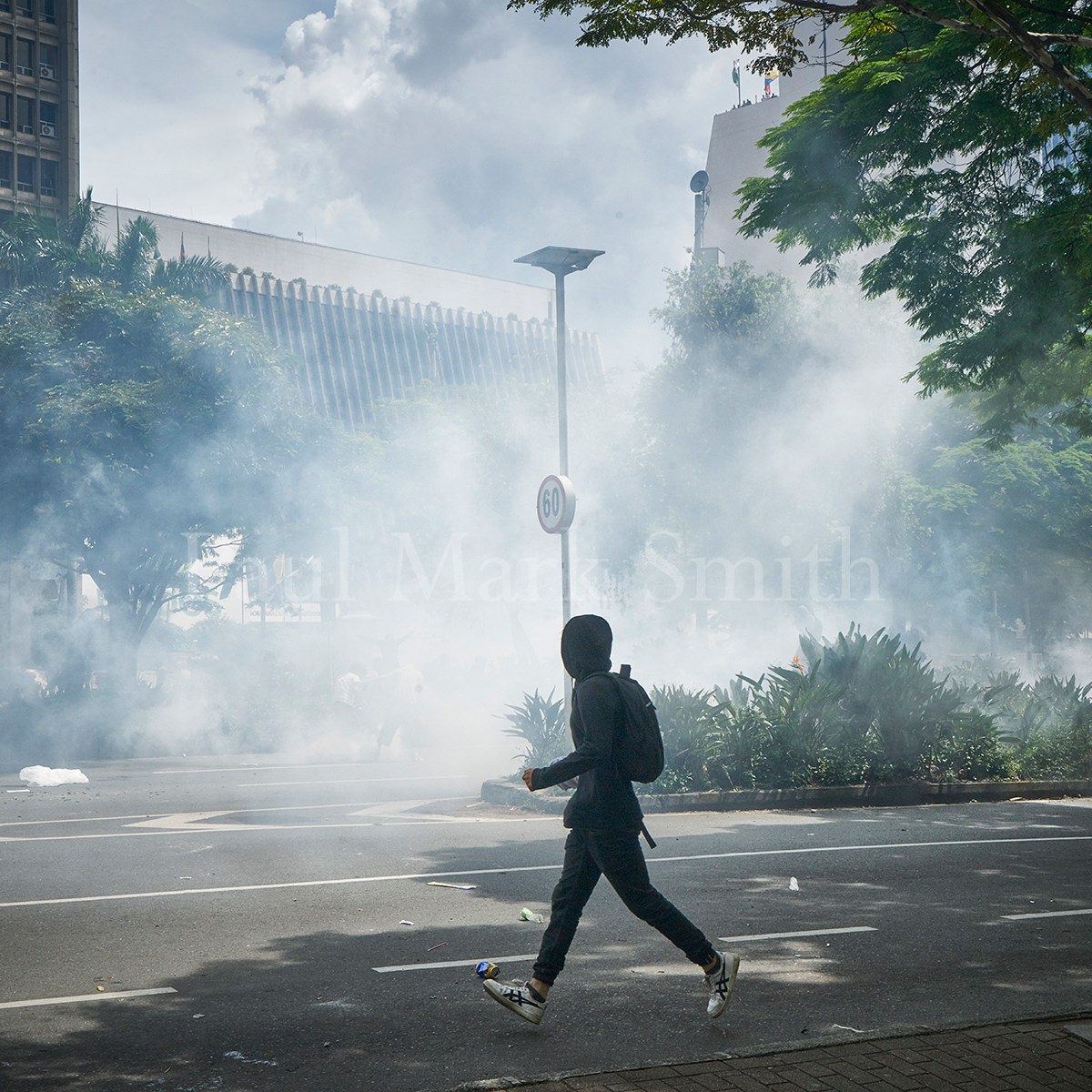 Tear gas floats over the street