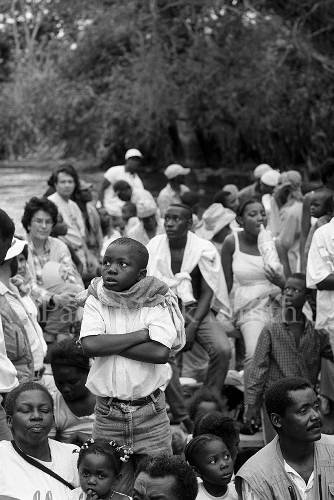 Passengers in a boat in silence as they approach their destination