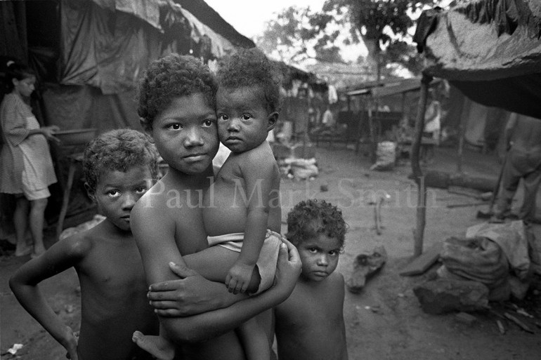 Four children in a camp for displaced people