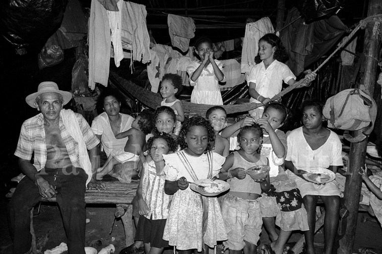 Many displaced people in a shelter at night time