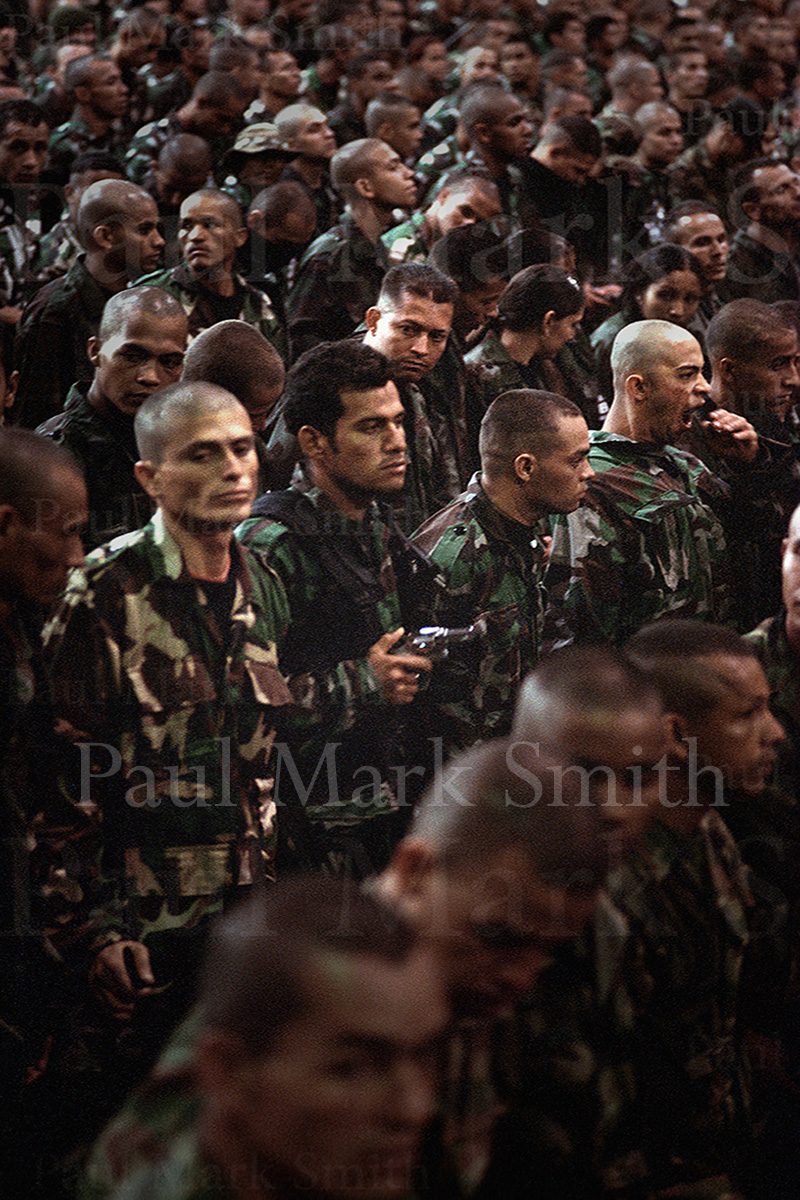 Paramilitary with revolver in demobilisation ceremony