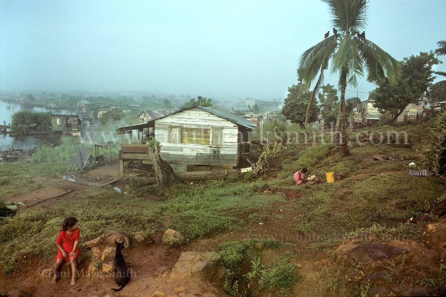 wooden homes on the edge of a Caribbean bay